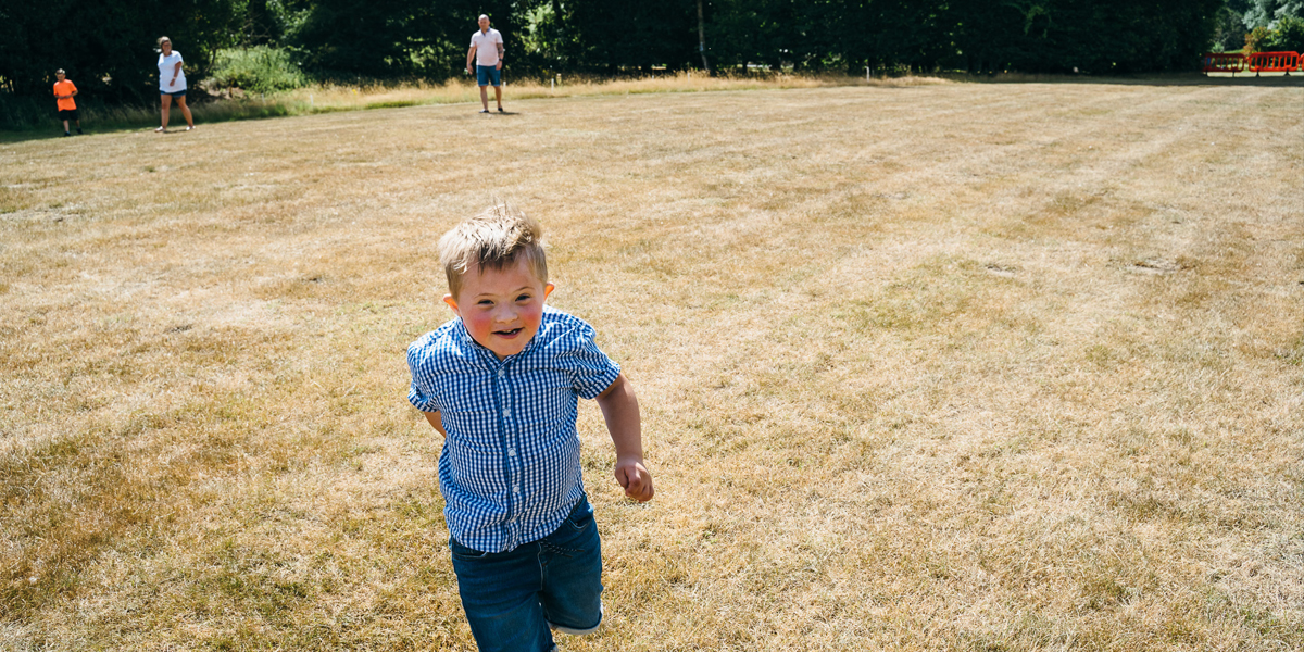 Boy playing in a field.