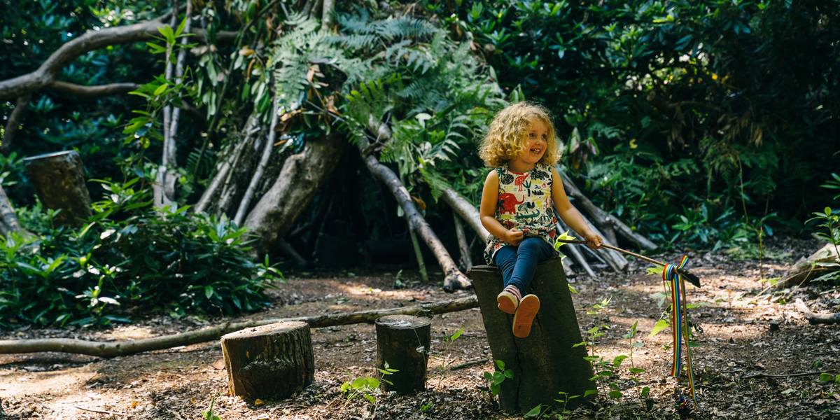 Girl playing at Wheatfen Forest School