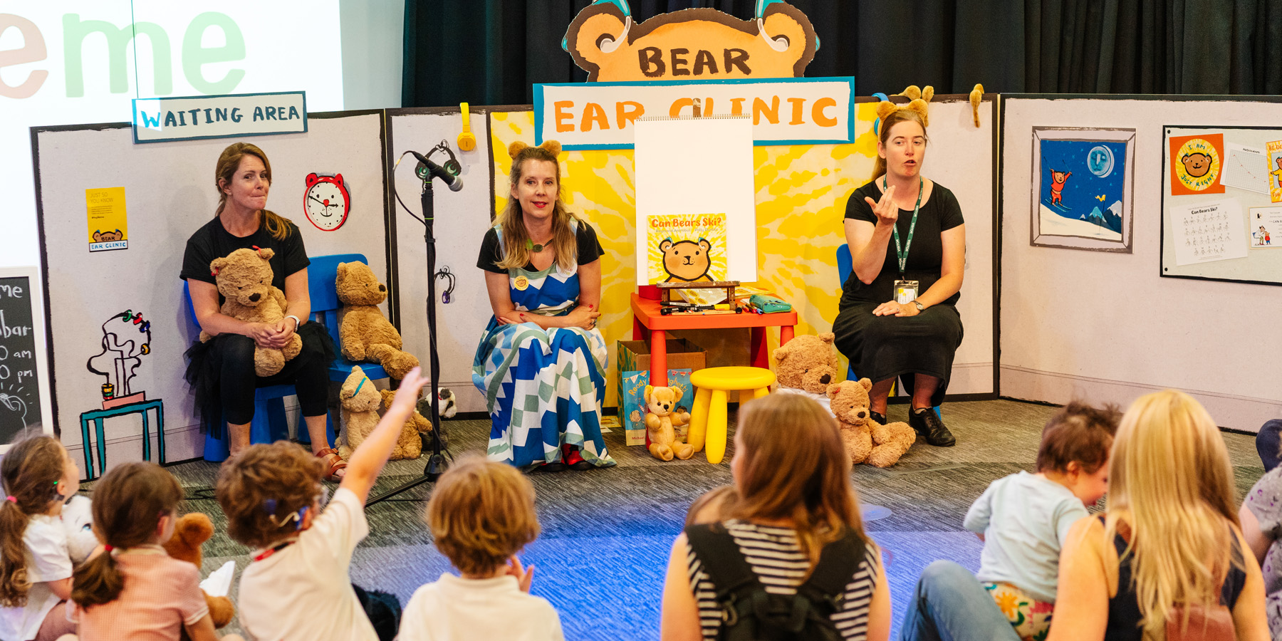 Two women on stage at the Bear Ear Clinic