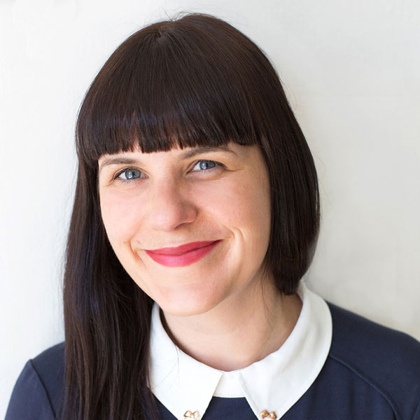 Image shows Rebecca Atkinson in a blue top with white collar.