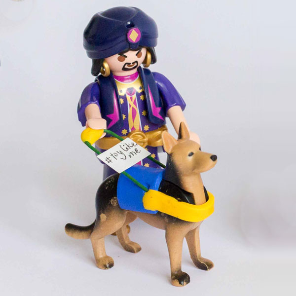 #ToyLikeMe makeover image showing Playmobil Genie figure with a guide dog. The guide dog