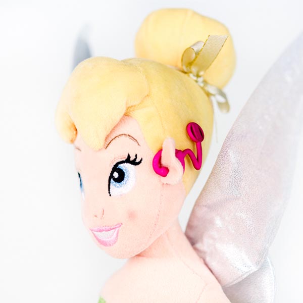 Plush Disney Tinkerbell doll with hot pink 3D printed cochlear implant.