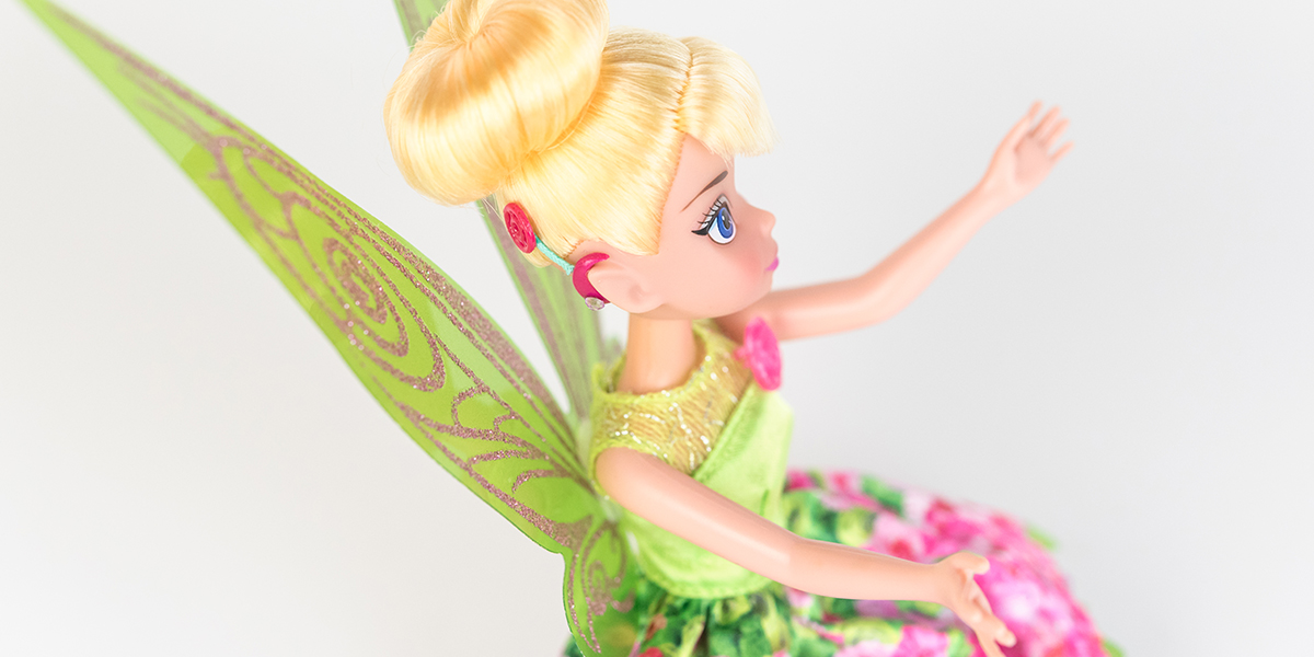 #ToyLikeMe makeover image showing Disney Tinkerbell doll with hot pink model cochlear implant.