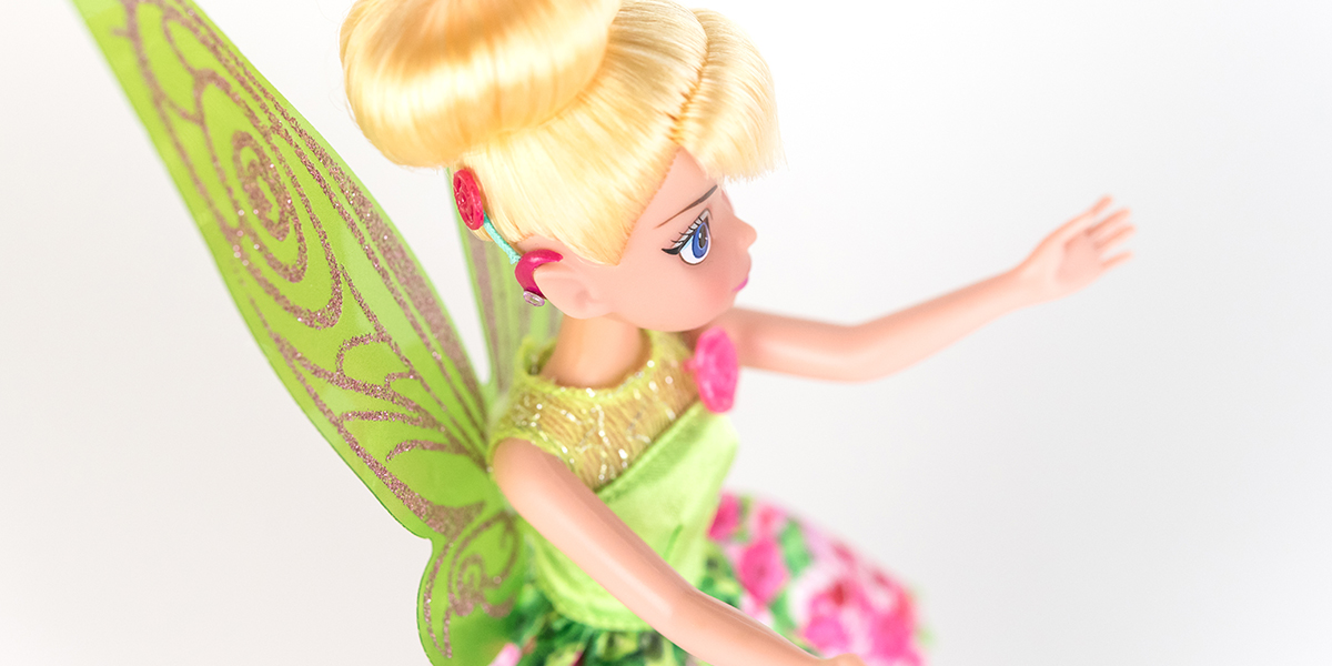 #ToyLikeMe makeover image showing Disney Tinkerbell doll with hot pink model cochlear implant.
