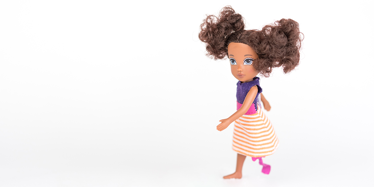 #ToyLikeMe makeover image of Moxie girl doll with pink and purple dress and model prosthetic blade.