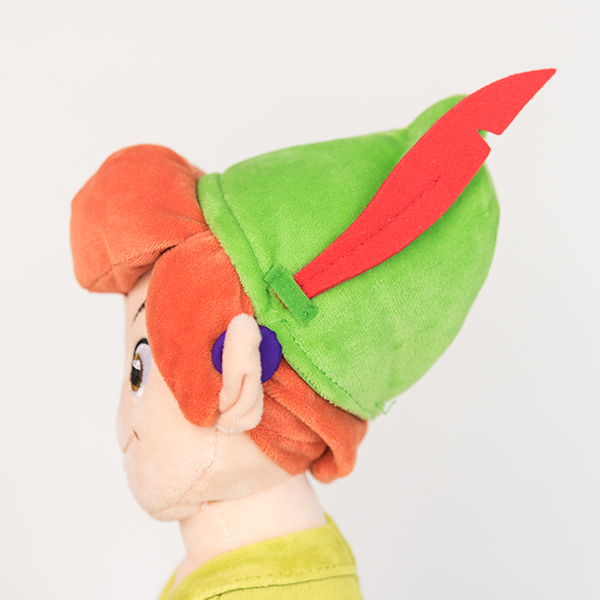 Plush Disney Peter Pan doll with purple 3D printed hearing aid.