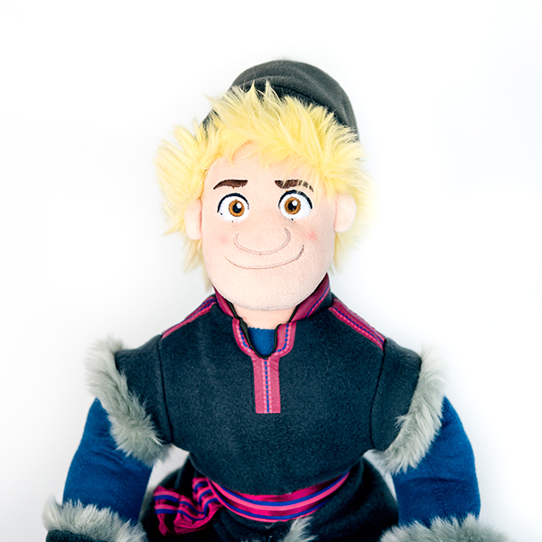 Plush Disney Frozen Kristoff doll with blonde hair, hat and fur trimmed coat.