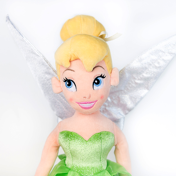 Plush Disney Tinkerbell doll with green dress and white wings.