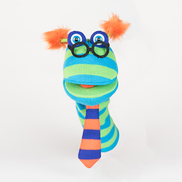 Blue and green striped woolen hand puppet with black glasses, orange fluffy ears and a school tie.