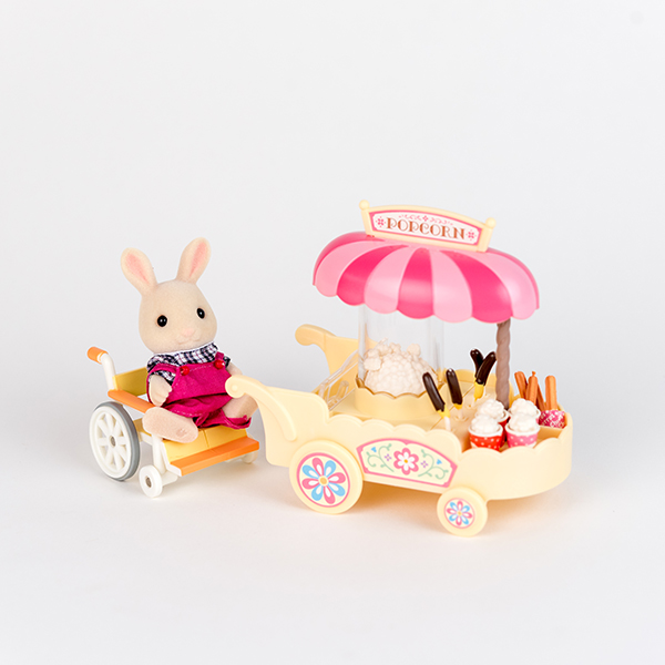 Image shows rabbit figure using pink wheelchair and working behind a pink popcorn cart.