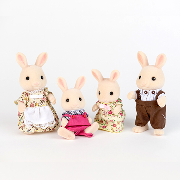 Image shows a family (parents and two children) of cream rabbit figures. All are wearing clothing.