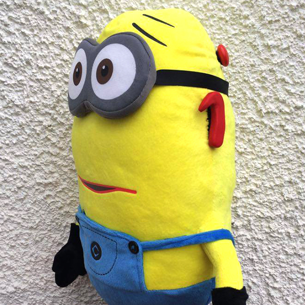 Community makeover image showing plush minion with model cochlear implant.