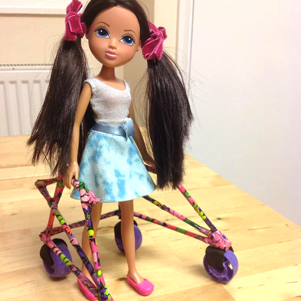 Community makeover image showing Moxie doll with a model K-walker.