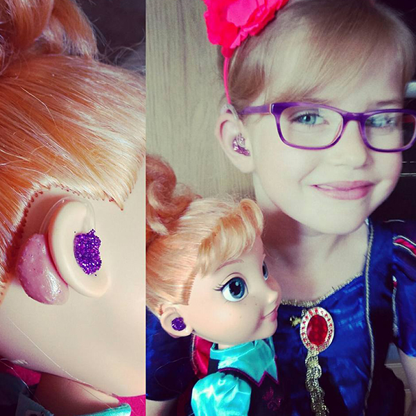 Community makeover image showing a girl and an Ana doll. Both have purple sparkly hearing aids.