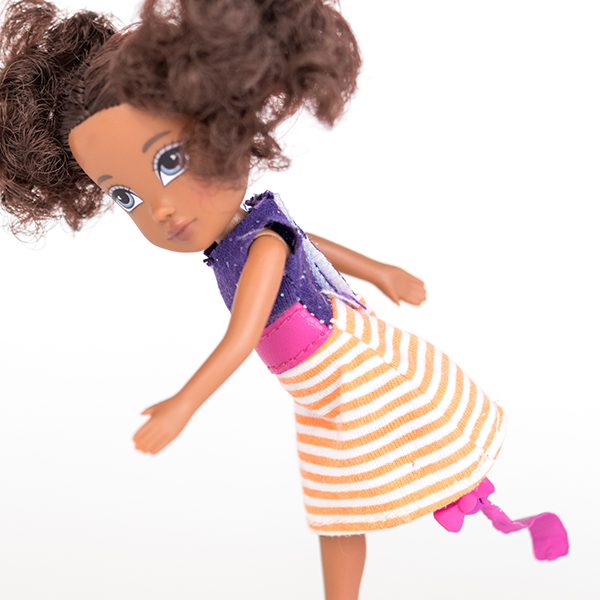 #ToyLikeMe makeover image of Moxie girl doll with pink and purple dress and model prosthetic blade.